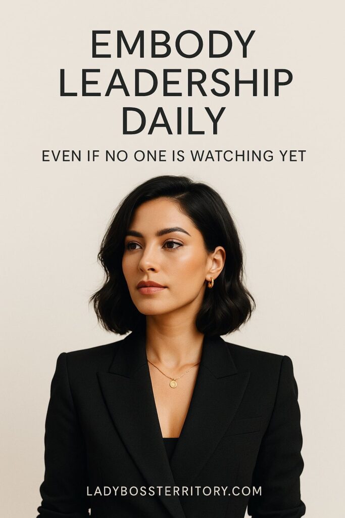 Confident female entrepreneur in a black blazer, embodying leadership daily with elegance and purpose.
